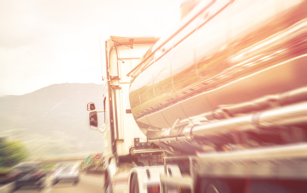 blurred image of a tanker truck on highway