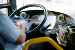 Bus interior view of the steering wheel and dashboard