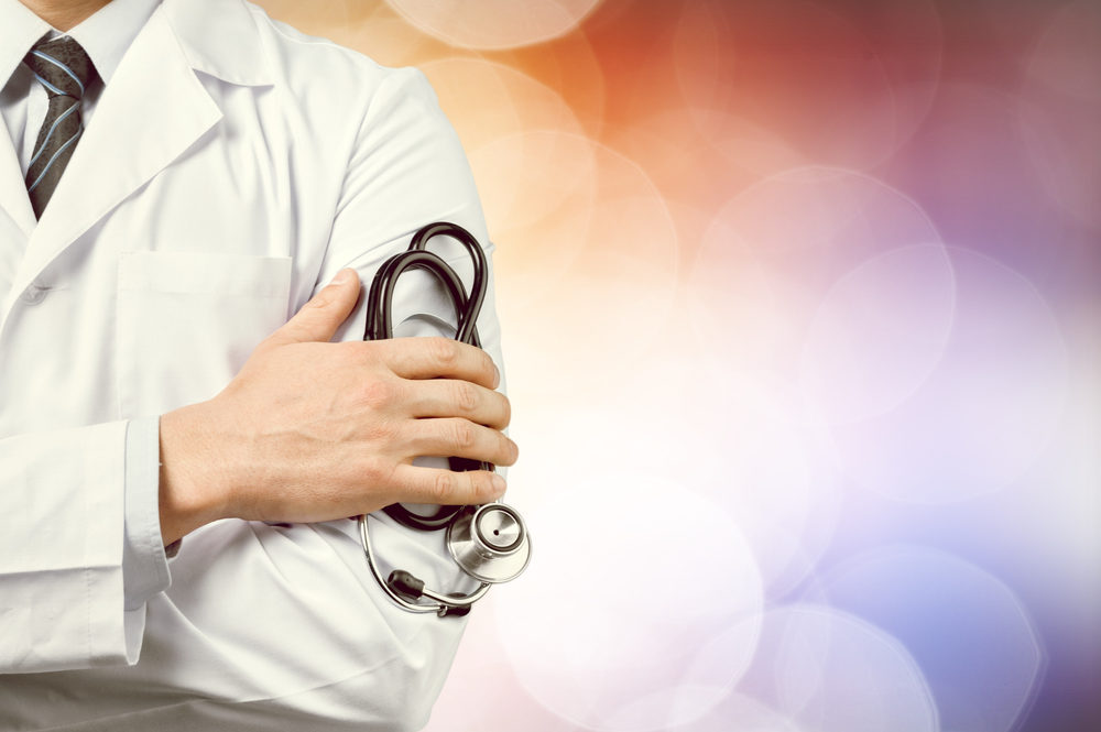 male doctor with a stethoscope with blurred background