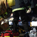 emergency services crew tending to a accident victim on a stretcher