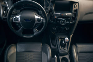 interior view of car dashboard and manual transmission