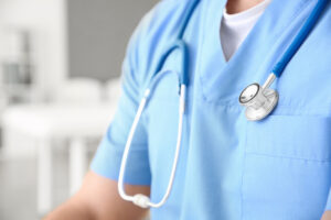 closeup of male nurse with stethoscope around neck