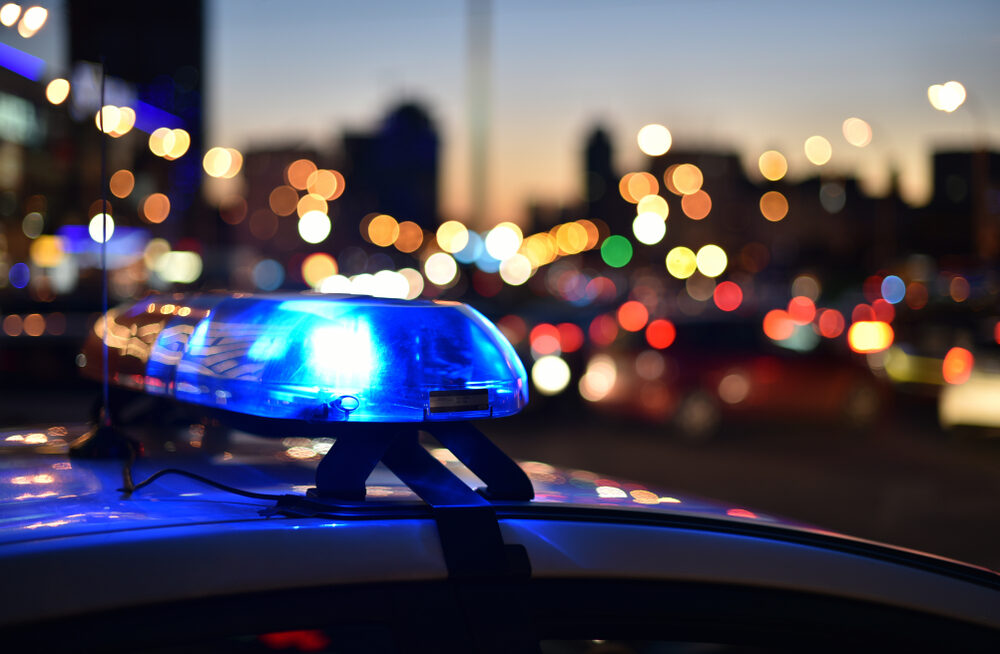 closeup of police cars flashing lights at night in the city