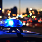 closeup of police cars flashing lights at night in the city