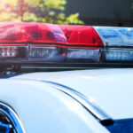 closeup of police lights on top of a cruiser in the daytime