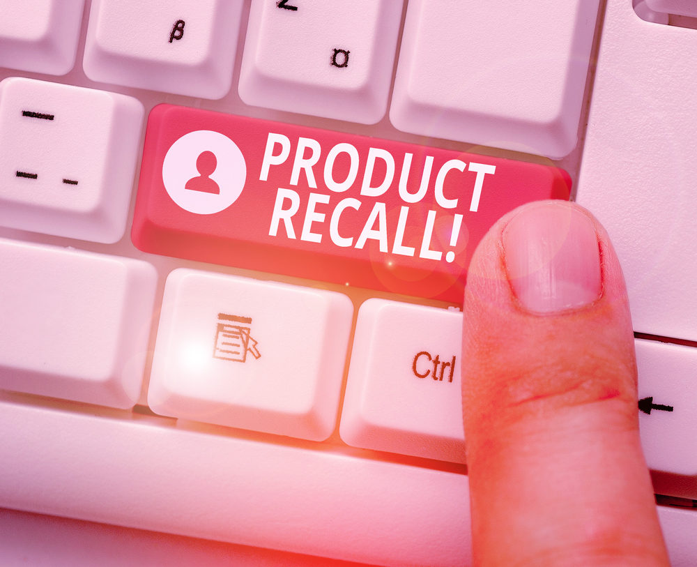 A user presses a red PRODUCT RECALL button on a keyboard