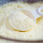 closeup of a spoon in powdered baby formula