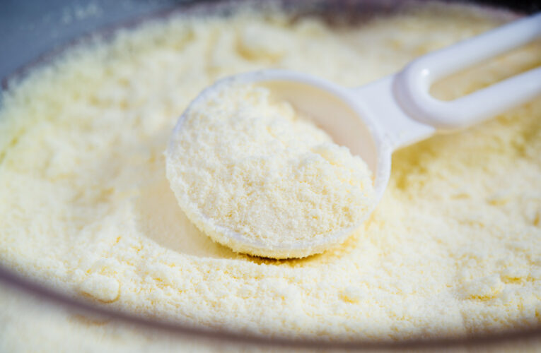 closeup of a spoon in powdered baby formula