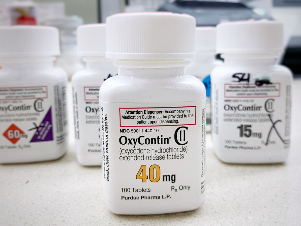 OxyContin bottles on a counter in a pharmacy