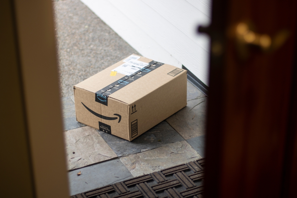 An Amazon Prime package delivered on a doorstep.